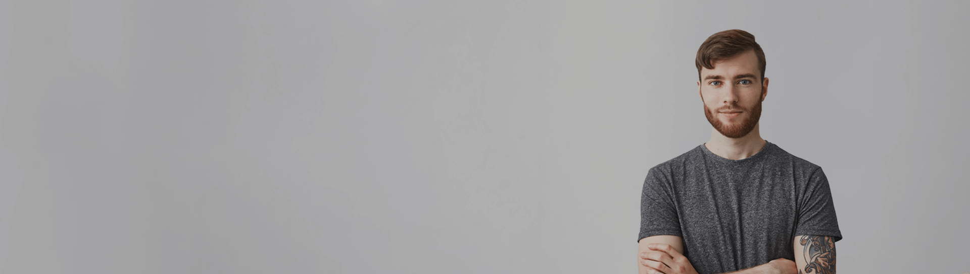 young programmer on gray background